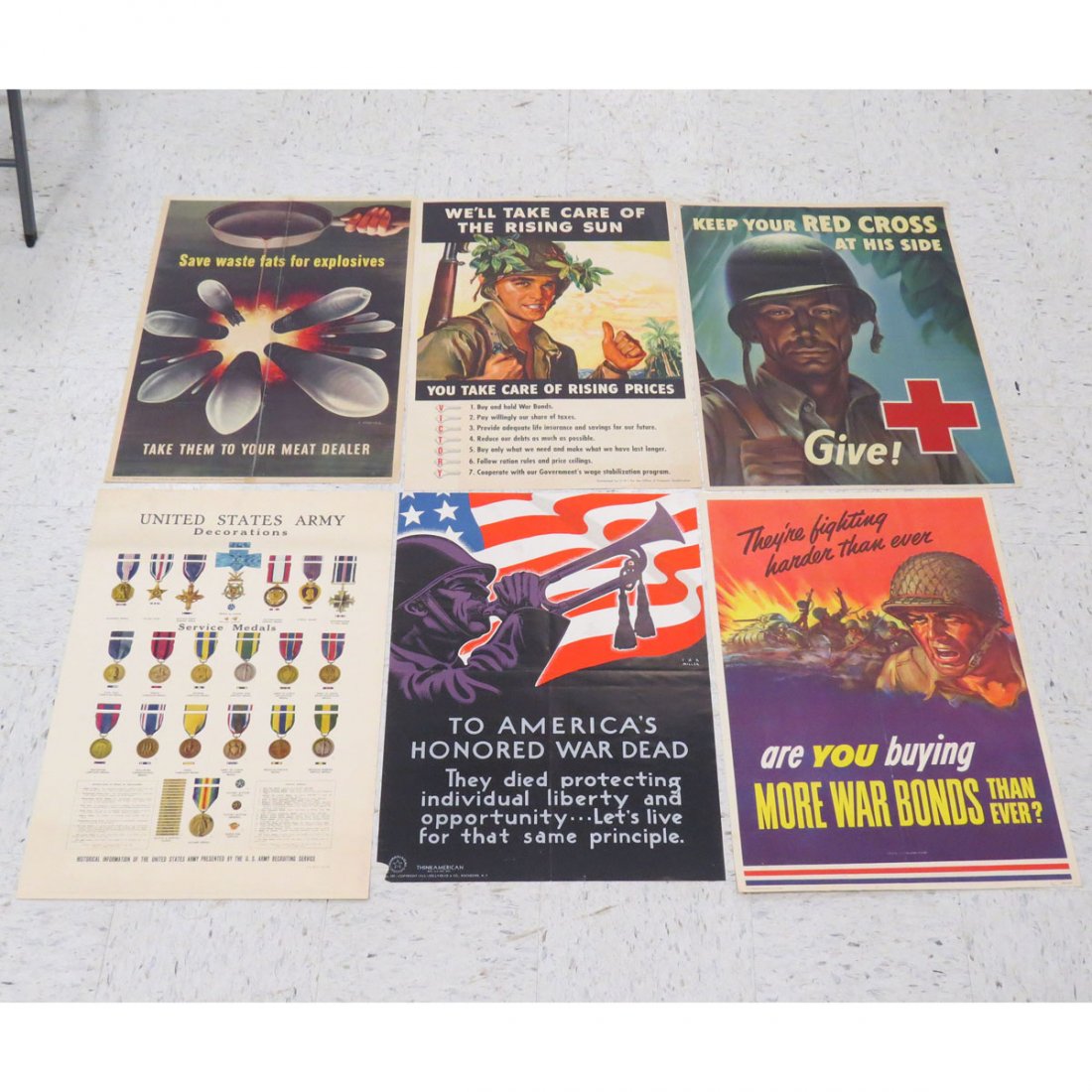 LOT (6) ASSORTED US WWII POSTERS: LOT (6) ASSORTED US WWII POSTERS INCLUDING RED CROSS, WE'LL TAKE CARE OF THE RISING SUN, SAVE WASTE FATS, THEY'RE FIGHTING HARDER THAN EVER, ETC. APPROXIMATELY 28 X 22