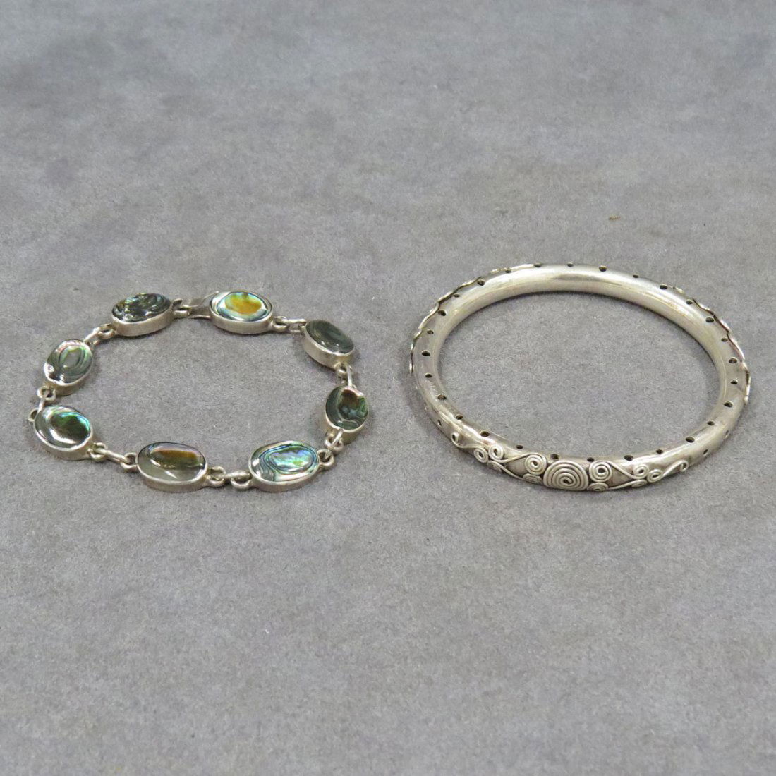 LOT (2) SILVER BRACELETS INCLUDING MEXICAN ABALONE: LOT (2) SILVER BRACELETS INCLUDING MEXICAN ABALONE BRACELET, LENGTH 8 1/4" AND BANGLE, SIGNED BA, DIAMETER 2 1/2". GROSS WEIGHT 1.45 OZT