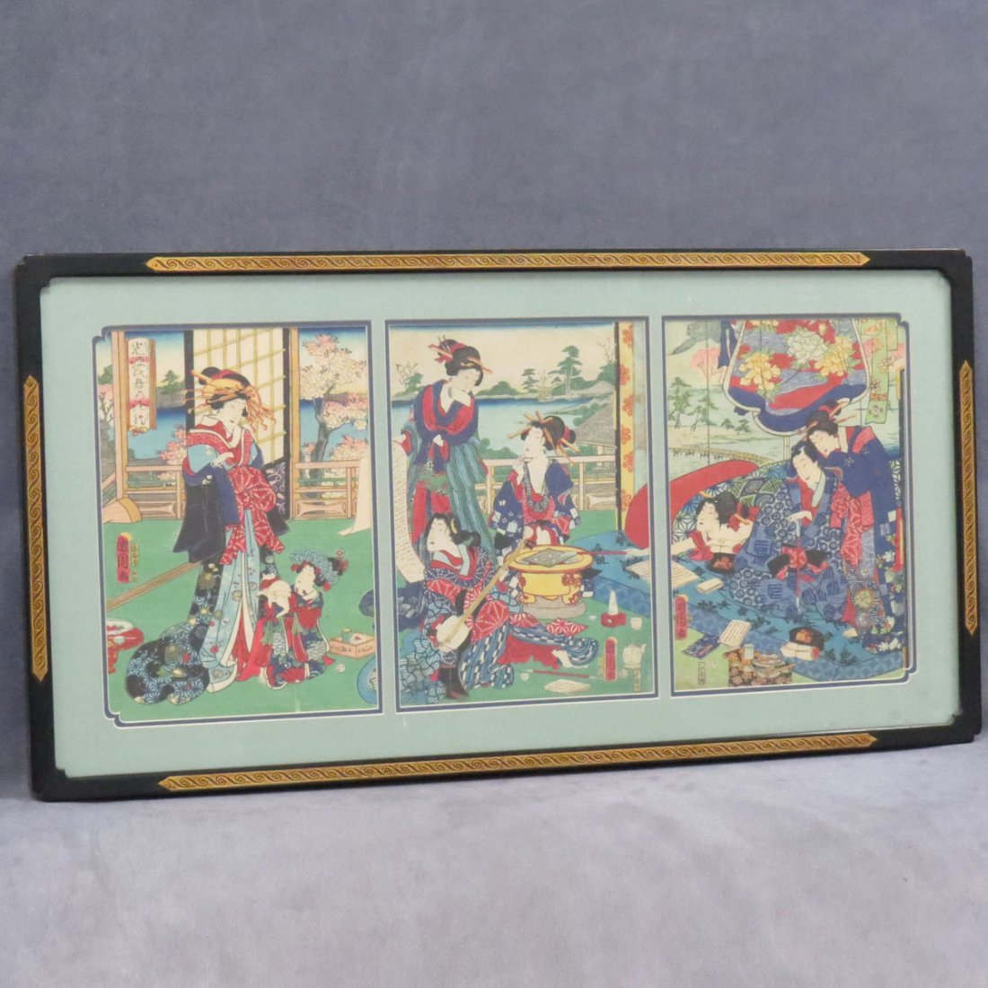 TOYOKUNI, UKIYO-E COLOR WOODBLOCK TRIPTYCH, GEISHA: TOYOKUNI, UKIYO-E COLOR WOODBLOCK TRIPTYCH, GEISHA IN AN INTERIOR. SIGHT 14 X 30"; FRAMED AND GLAZED-20 X 36"