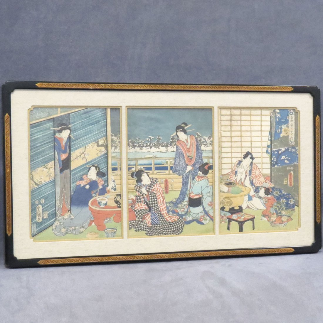TOYOKUNI III, UKIYO-E COLOR WOODBLOCK TRIPTYCH: TOYOKUNI III, UKIYO-E COLOR WOODBLOCK TRIPTYCH, WOMEN IN AN INTERIOR-WINTER. SIGHT 13 3/4 X 29 1/2"; FRAMED AND GLAZED-19 X 35"