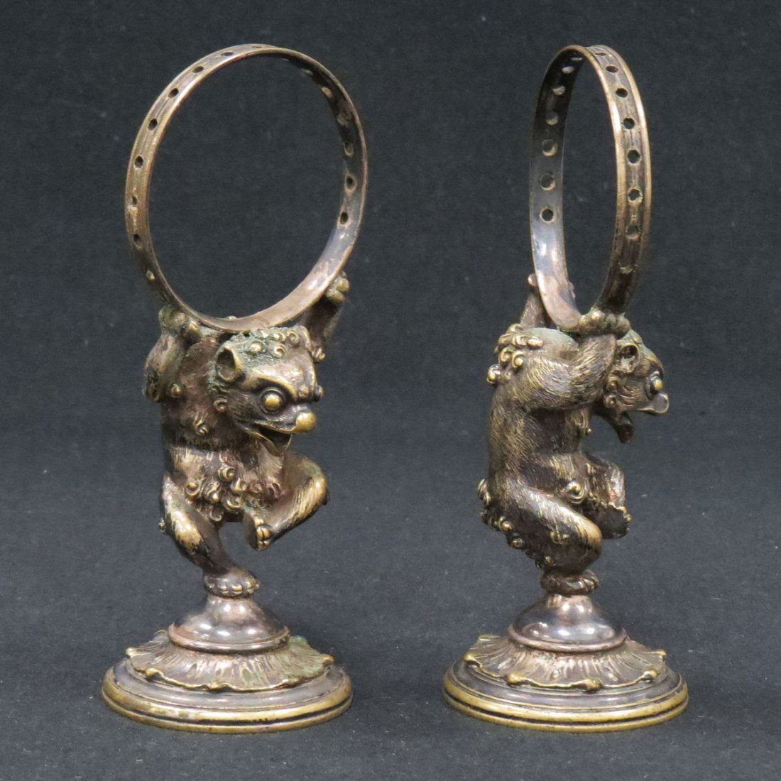 PAIR CHRISTOFLE/PARIS GILT BRONZE NAPKIN: PAIR CHRISTOFLE/PARIS GILT BRONZE GARGOYLE-FORM FIGURAL NAPKIN HOLDERS, SIGNED #336633. HEIGHT 5"