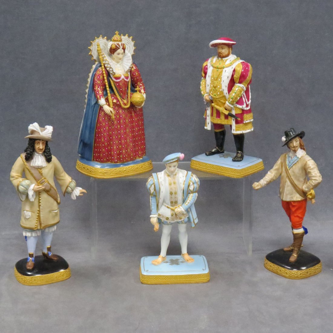 LOT (5) ROYAL WORCESTER DECORATED PORCELAIN FIGURE: LOT (5) ROYAL WORCESTER DECORATED PORCELAIN FIGURES INCLUDING QUEEN ELIZABETH, HEIGHT 10"; HENRY VIII, HEIGHT 9 1/2"; CHARLES I, HEIGHT 10"; EDWARD VI, HEIGHT 8 1/2"; CHARLES II, HEIGHT 10 3/4" (IMPER