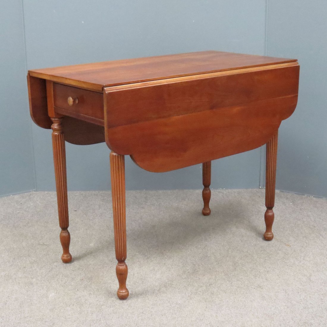 STICKLEY SHERATON STYLE CHERRY PEMBROKE TABLE: STICKLEY SHERATON STYLE CARVED CHERRY PEMBROKE TABLE, SIGNED. HEIGHT 30"; LENGTH 36"