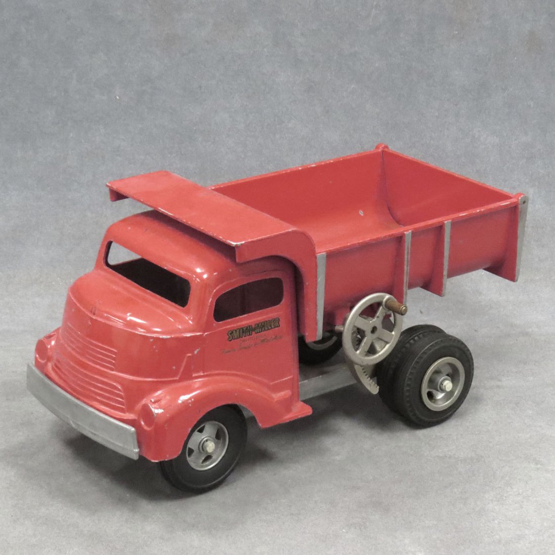 VINTAGE SMITH MILLER DUMP TRUCK: VINTAGE SMITH MILLER DUMP TRUCK. LENGTH 11 1/2"