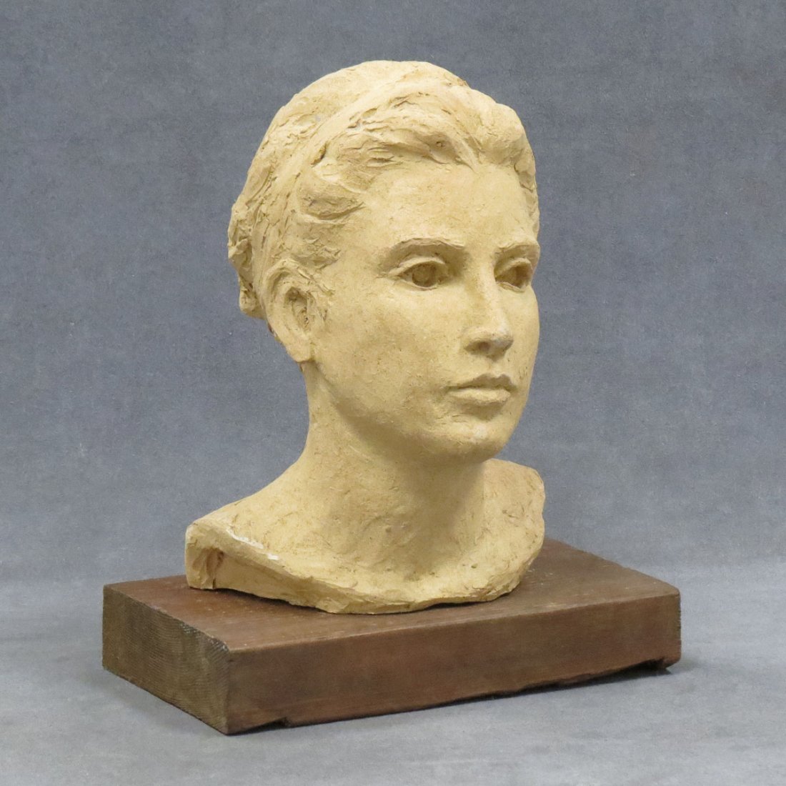 PAM SHAWE (AMERICAN 20TH CENTURY), POTTERY BUST: PAM SHAWE (AMERICAN 20TH CENTURY), POTTERY BUST OF A YOUNG WOMAN, UNSIGNED. HEIGHT 9"