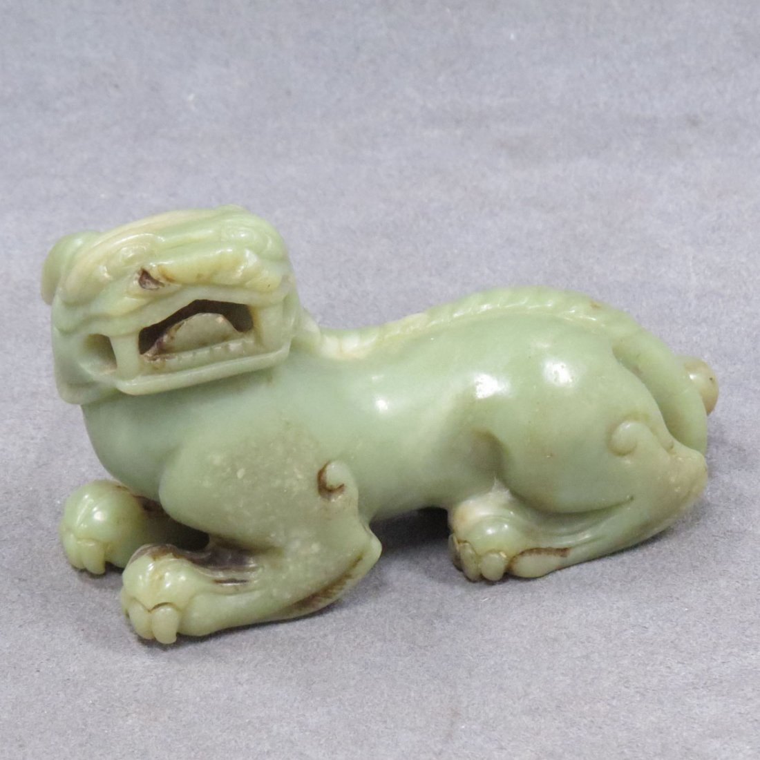 CHINESE CARVED CELADON JADE FOO DOG: CHINESE CARVED CELADON JADE FOO DOG. LENGTH 5"