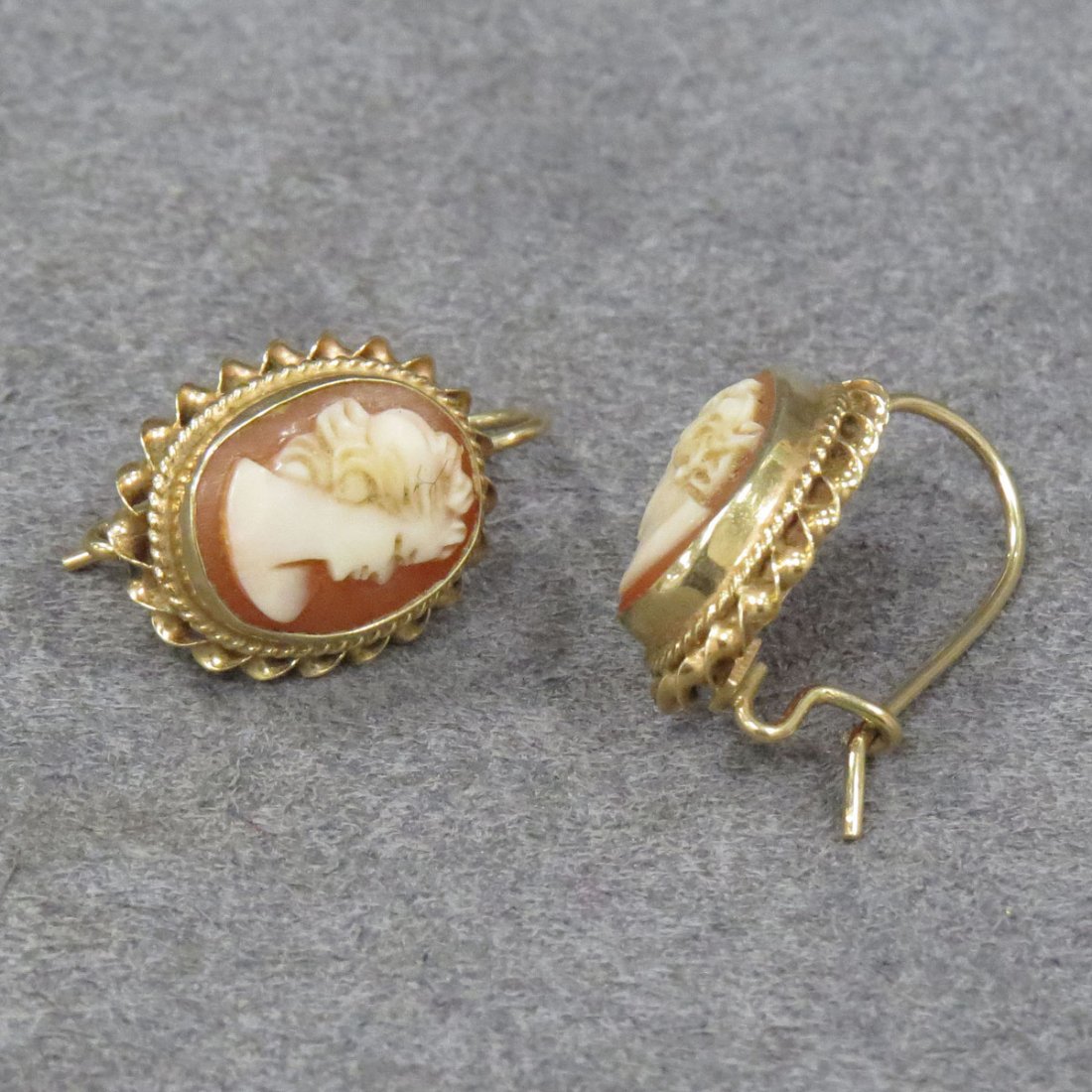 14K YELLOW GOLD FRAMED CARVED CAMEO EARRINGS: 14K YELLOW GOLD FRAMED CARVED SHELL CAMEO HOOP BACK PIERCED EARRINGS. LENGTH 3/4"; GROSS WEIGHT 3.48 GRAMS