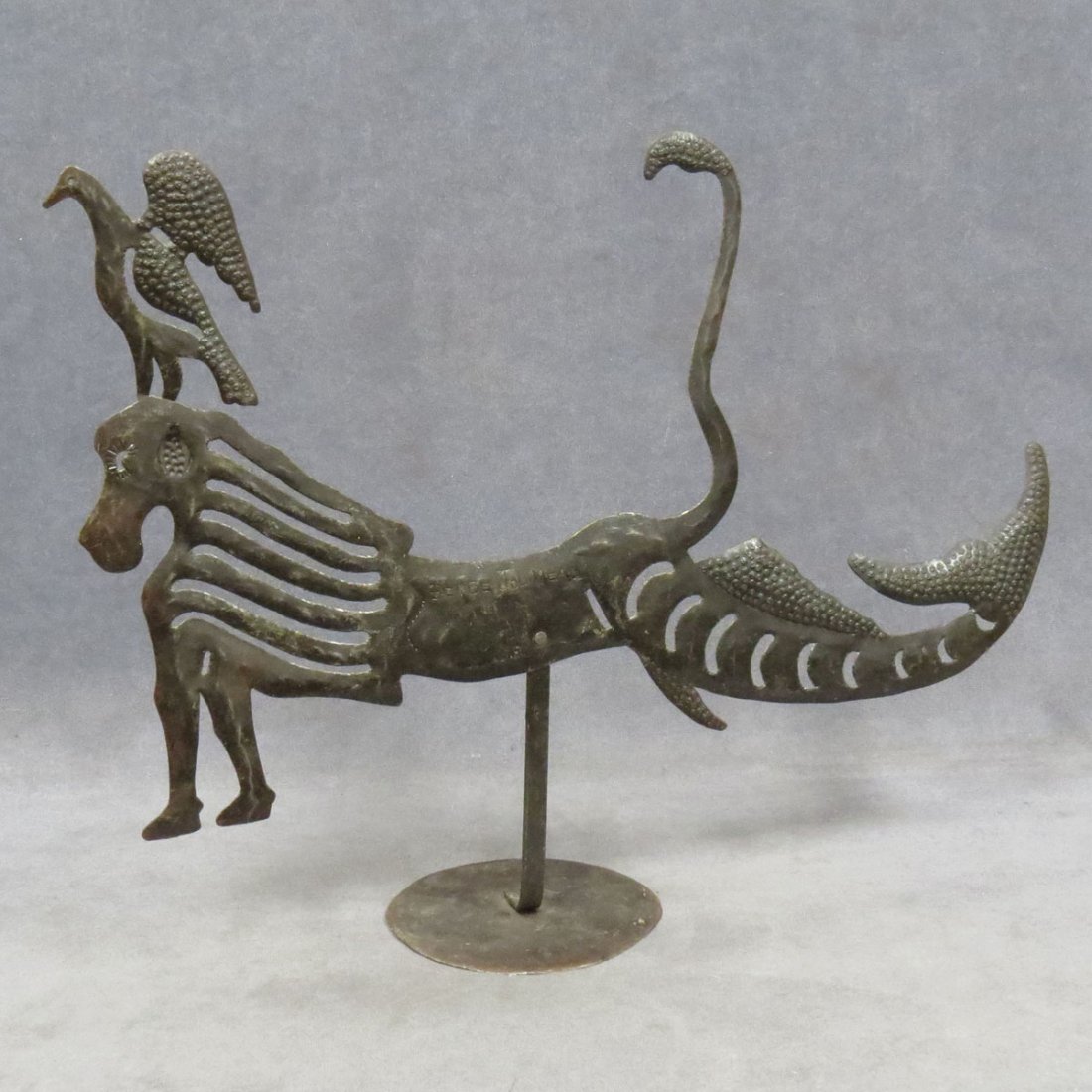 SERGE JOLINEAU (HAITIAN 1952-), RECYCLED STEEL: SERGE JOLINEAU (HAITIAN 1952-), RECYCLED STEEL DRUM, SEA HORSE WITH BIRD, SIGNED. LENGTH 21 1/4"