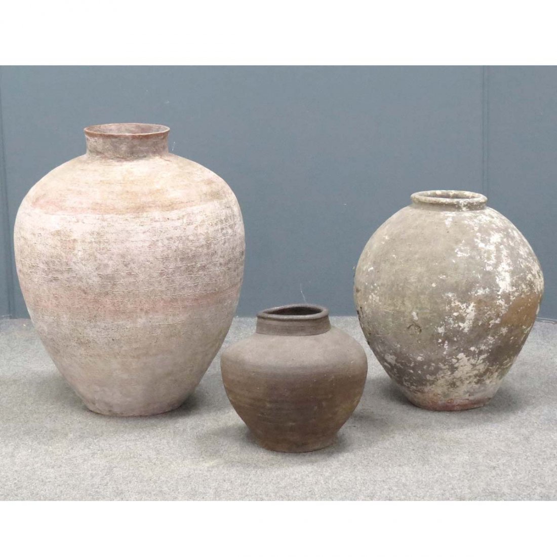 LOT (3) ANAMESE (VIETNAM) POTTERY STORAGE JARS: LOT (3) ANAMESE (VIETNAM) POTTERY STORAGE JARS. HEIGHT 10 1/2-23" (IMPERFECT)