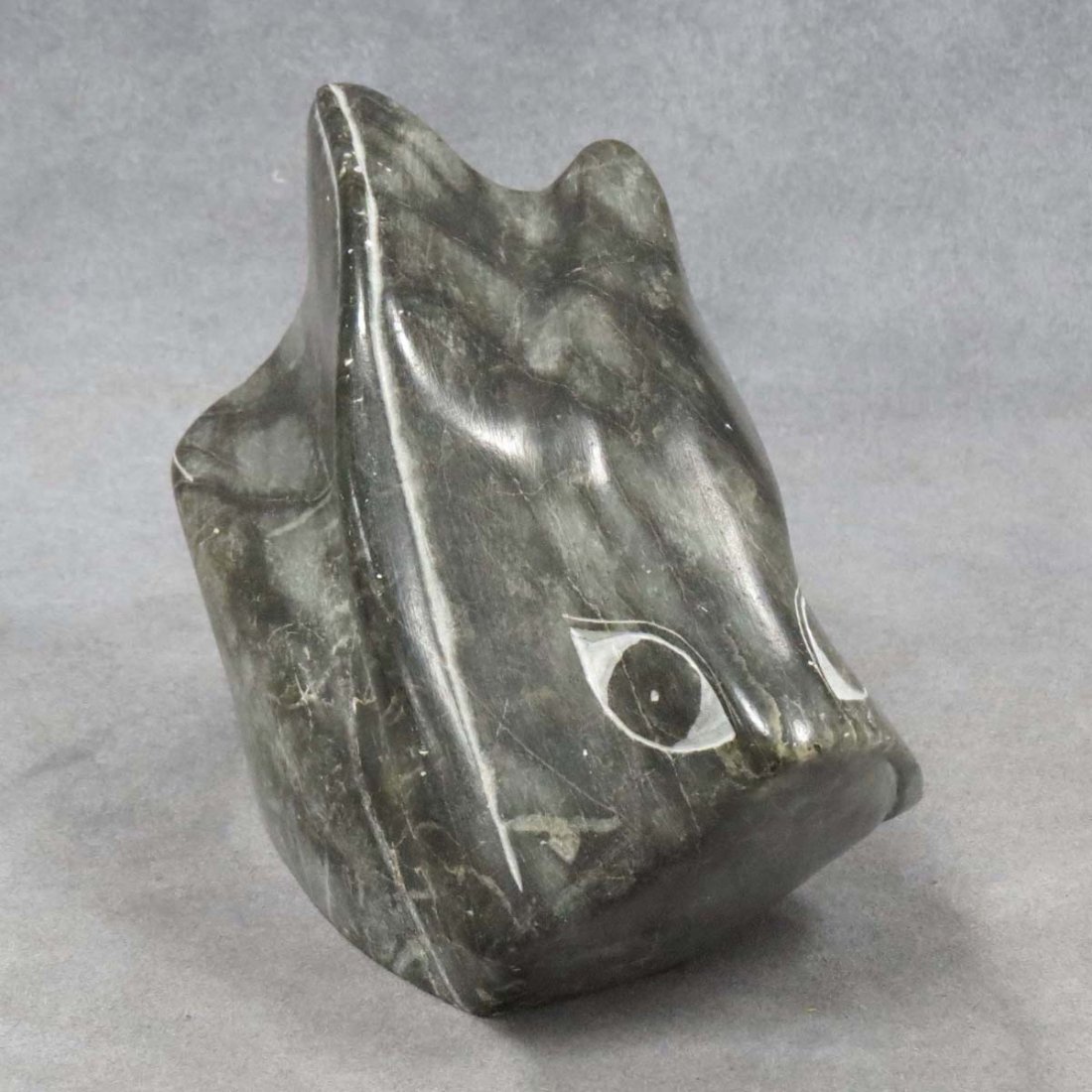 NORTH WEST COAST STEATITE FIGURE OF A SALMON: NORTH WEST COAST CARVED STEATITE FIGURE OF A SALMON, SIGNED LEVI SMITH 1973. LENGTH 7"