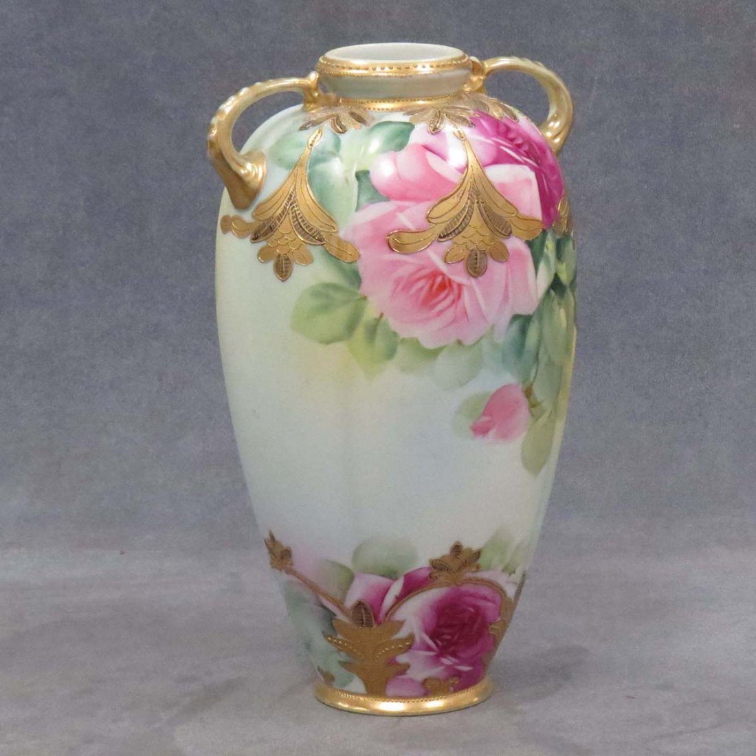 NIPPON HAND PAINTED GILT DECORATED VASE: NIPPON HAND PAINTED GILT DECORATED DOUBLE HANDLE PORCELAIN VASE. HEIGHT 9 3/4"