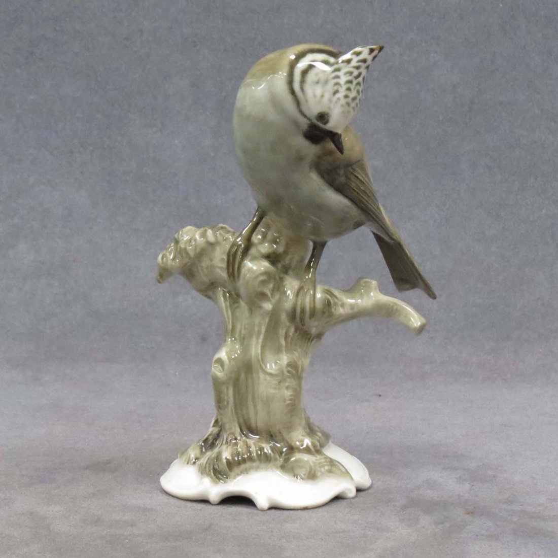 HUTSCHENREUTHER PORCELAIN BIRD, SIGNED K. TUTTER: HUTSCHENREUTHER PORCELAIN BIRD, SIGNED K. TUTTER. HEIGHT 6 1/2"
