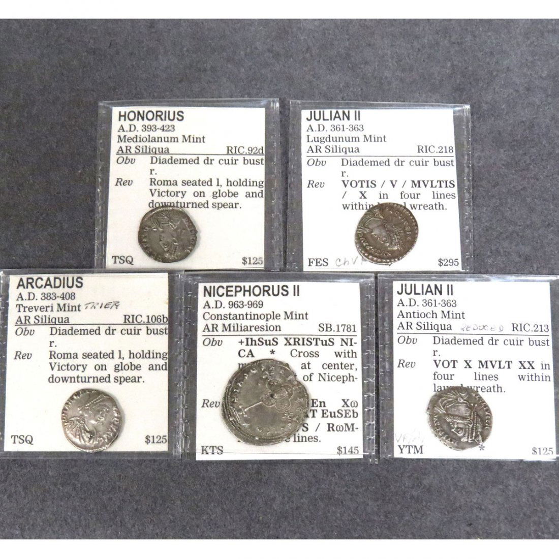LOT (5) ROMAN EMPIRE SILVER COINS: LOT (5) ROMAN EMPIRE SILVER COINS INCLUDING (2) JULIAN II, AR SILIQUA, 361-363 AD, 16 MM; ARCADIUS, AR SILIQUA, 383-408 AD, 18 MM; HONORIUS AR SLIQUA, 393-423 AD, 17 MM; NICEPHORUS II, AR MILIARESION,