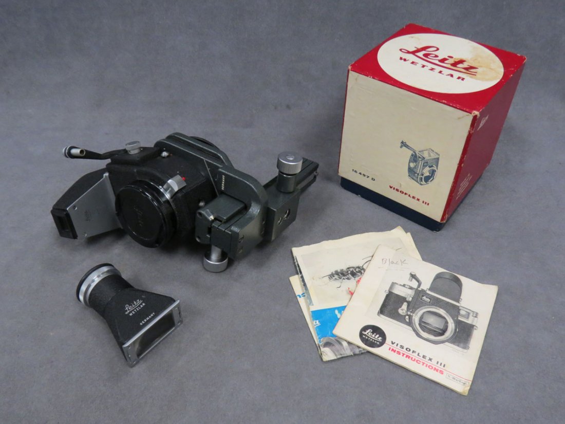 LOT INCLUDING LEITZ VISOFLEX III: LOT INCLUDING LEITZ VISOFLEX III WITH (2) VIEW FINDERS AND FOCUSING BELLOWS II (FITS ALL LEICA-M CAMERAS) WITH INSTRUCTION MANUALS