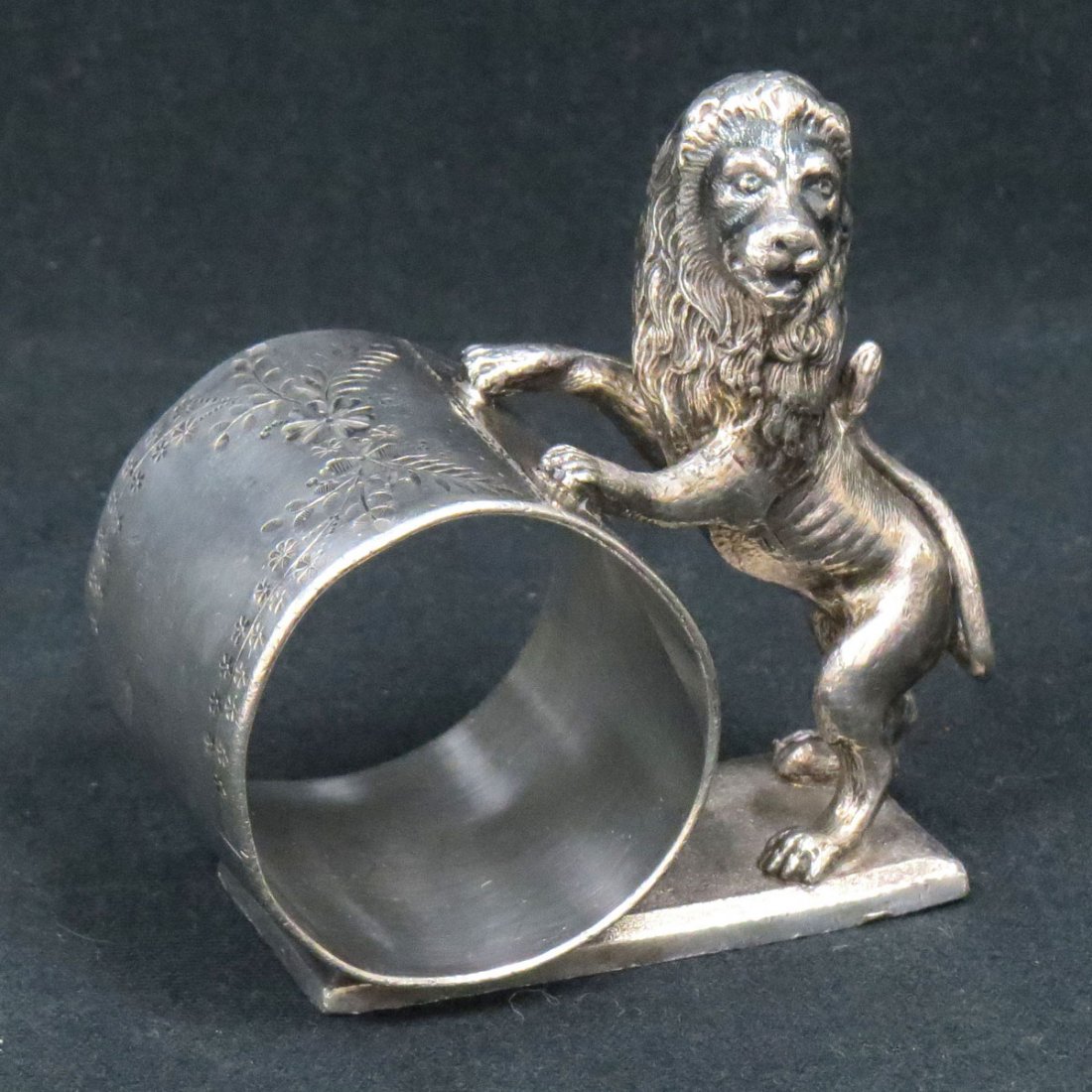 MERIDEN SILVER PLATE FIGURAL NAPKIN RING WITH LION: MERIDEN SILVER PLATE FIGURAL NAPKIN RING WITH LION, 19TH CENTURY. HEIGHT 3"