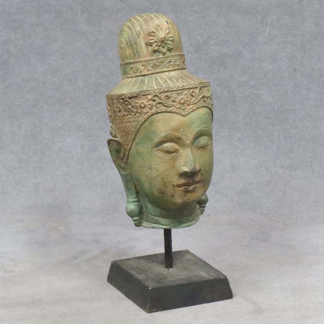CAMBODIAN BRONZE HEAD OF BUDDHA ON STAND: CAMBODIAN BRONZE HEAD OF BUDDHA ON STAND. HEIGHT 10"
