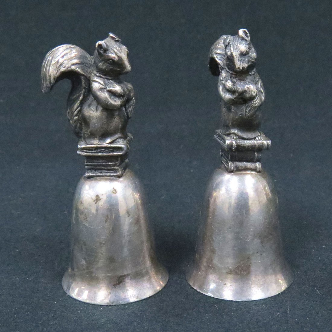 LOT (2) SILVER PLATE FIGURAL BELLS WITH SQUIRRELS: LOT (2) SILVER PLATE FIGURAL BELLS WITH SQUIRRELS, MONOGRAMMED "NE". HEIGHT 2 7/8"