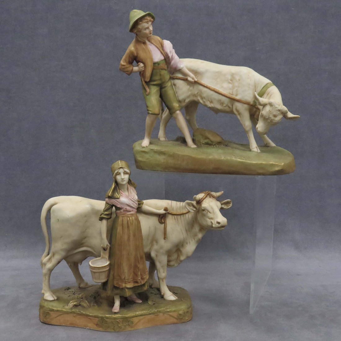 LOT (2) ROYAL DUX DECORATED PORCELAIN FIGURES: LOT (2) ROYAL DUX DECORATED PORCELAIN FIGURES OF MILKMAID AND BOY WITH COW, SIGNED. HEIGHT 11"; LENGTH 13"