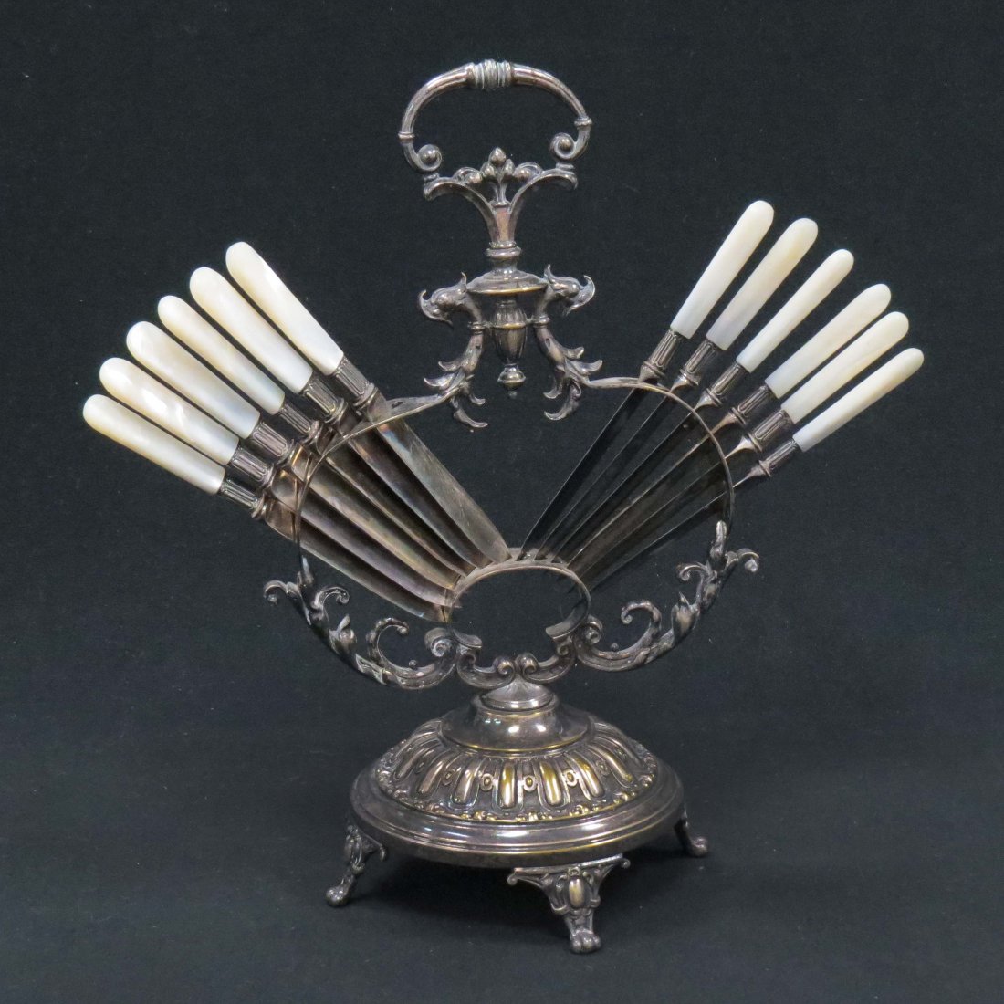 SET (12) HARRISON BROTHERS & HOWSON FRUIT KNIVES: SET (12) HARRISON BROTHERS & HOWSON SILVER PLATE FRUIT KNIVES WITH SILVER BAND AND VICTORIAN SILVER-OVER-COPPER KNIFE STAND. HEIGHT 11 1/2"