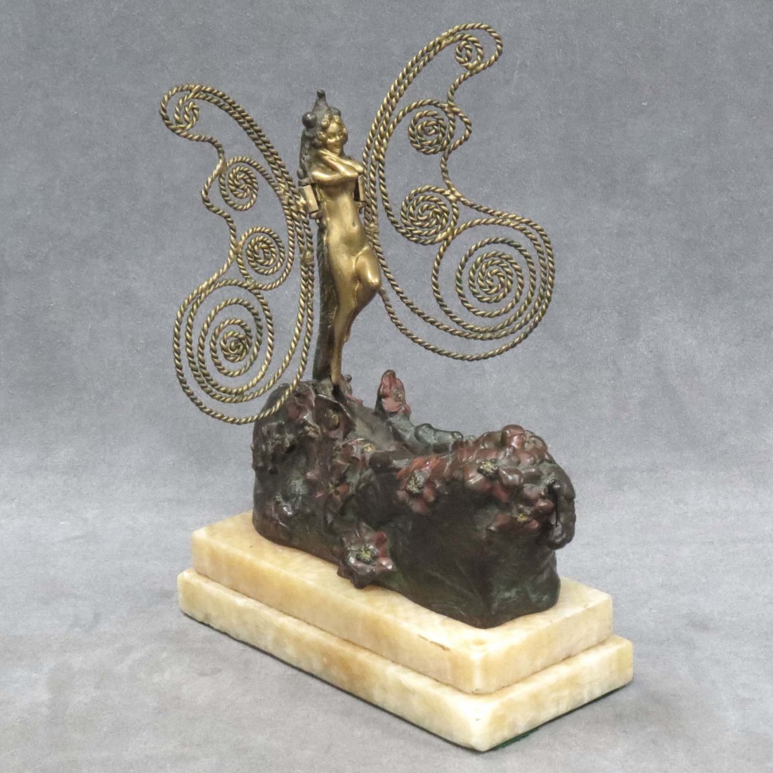 CARL KAUBA (AUSTRIAN/AMERICAN 1865-1922): CARL KAUBA (AUSTRIAN/AMERICAN 1865-1922), POLYCHROME AND GILT BRONZE, "NAUGHTY" MECHANICAL DRAGON FLY/NYMPH, METAMORPHOSIS, SIGNED WITH ONYX BASE. HEIGHT 10 1/2"; LENGTH 7 1/2"