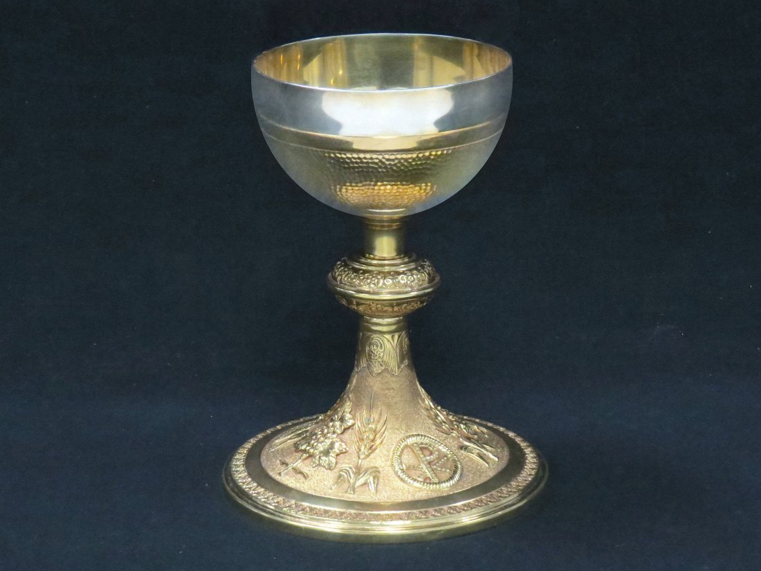 FINE SILVER CUP CHALICE WITH REPOUSSE BRASS BASE: FINE SILVER CUP CHALICE WITH REPOUSSE BRASS BASE. HEIGHT 7 1/4"