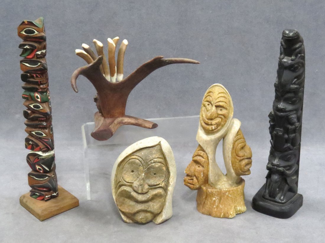 LOT INCLUDING (2) EASTERN WOODLANDS FIGURES: LOT INCLUDING (2) EASTERN WOODLANDS CARVED STONE FALSE FACE FIGURES, HEIGHT 5 1/2-8 1/2"; (2) CARVED NW COAST TOTEM POLES (one carved wood, other composition), HEIGHT 12-12 1/2"; ANTLER KNIFE SET