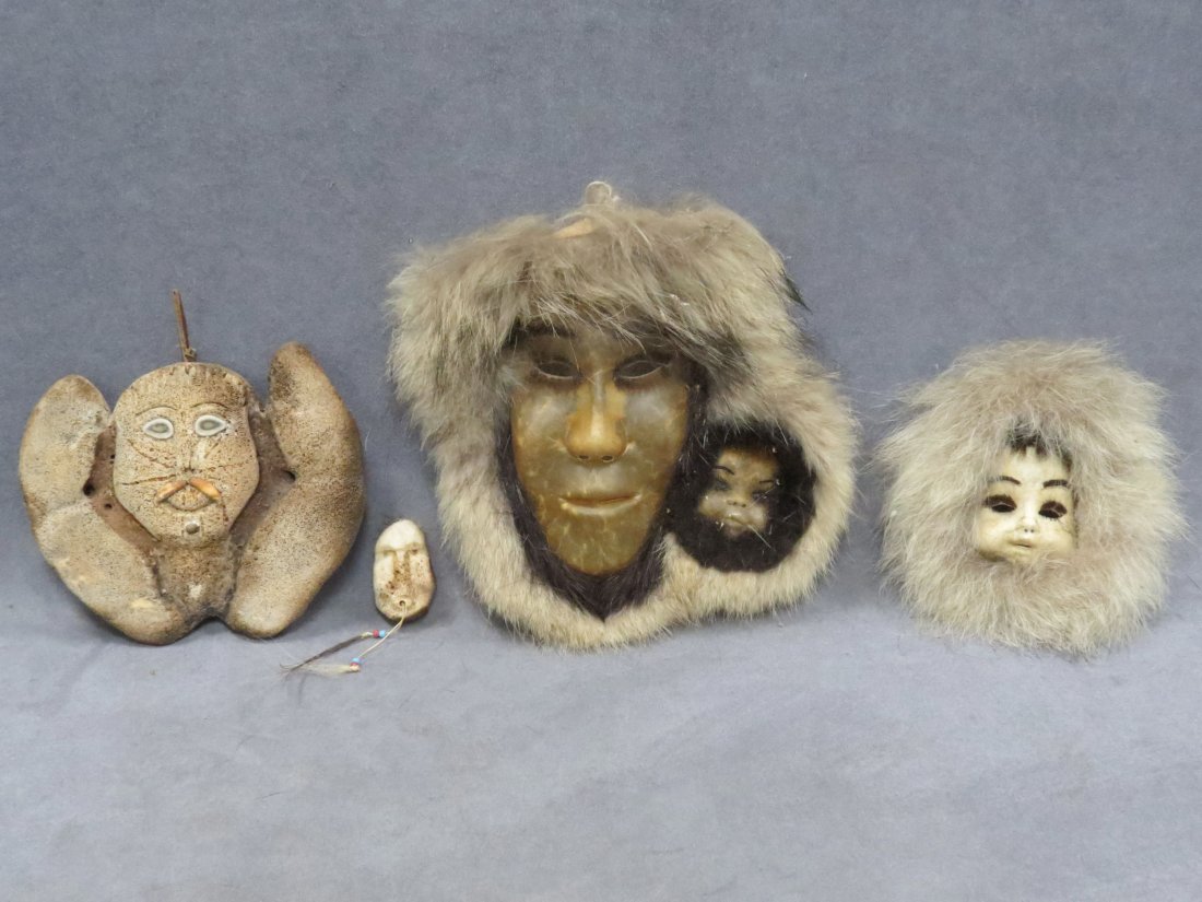 LOT (4) N.W. COAST INCLUDING BALEEN MASK: LOT (4) N.W. COAST INCLUDING CARVED AND INLAID BALEEN MASK, ROSIE EUTUK, SHISHMAREF ALASKA, 6 X 7"; CARVED WHALE BONE PENDANT, HEIGHT 2 1/4"; (2) SEAL SKIN MASKS, EUNICE AISHANNA AND MARY LOU LEAVITT 