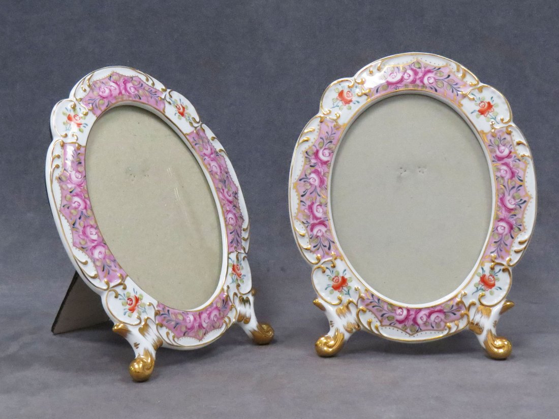 PAIR DRESDEN STYLE PICTURE FRAMES: PAIR DRESDEN STYLE GILT AND HAND ENAMELED PORCELAIN STANDING OVAL PICTURE FRAMES. HEIGHT 10 1/2"