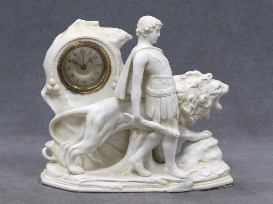 VINTAGE PARIAN FIGURAL CASED SHELF CLOCK: VINTAGE PARIAN FIGURAL CASED SHELF CLOCK. HEIGHT 8 1/2"; LENGTH 9 1/2"