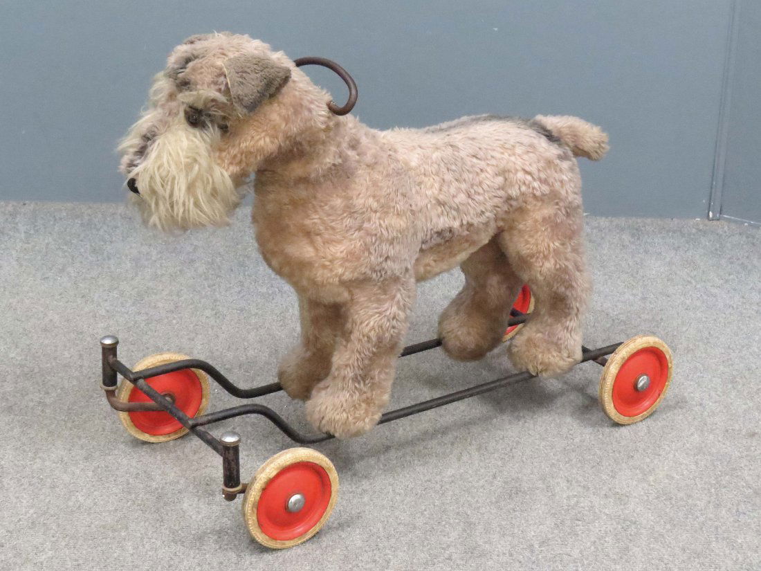 VINTAGE STEIFF TERRIER RIDING TOY, SIGNED: VINTAGE STEIFF TERRIER RIDING TOY, SIGNED. HEIGHT 20"; LENGTH 24" (MISSING 1/GLASS EYE)