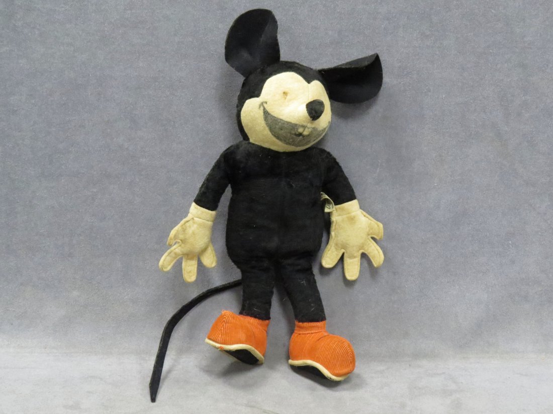 VINTAGE MICKEY MOUSE STUFFED CHARACTER FIGURE: VINTAGE MICKEY MOUSE STUFFED CHARACTER FIGURE WITH VELVET BODY, FELT HANDS, EARS, FACE AND CORDUROY SHOES, CHARACTER NOVELTY CO, SOUTH NORWALK CT WITH ORIGINAL LABEL. HEIGHT 14" (MISSING EYES)