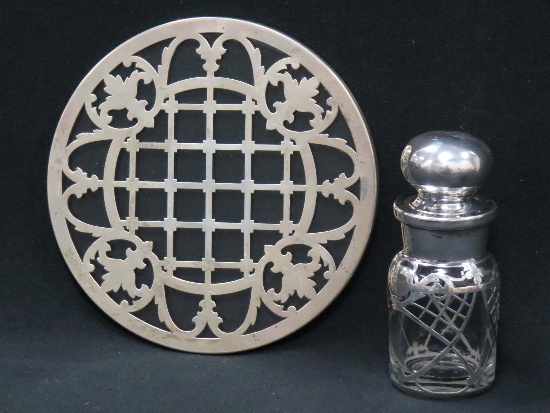 LOT (2) STERLING OVERLAY TRIVET AND HEISEY DRESSER: LOT (2) STERLING OVERLAY TRIVET AND HEISEY DRESSER BOTTLE, MONOGRAMED. DIAMETER 7"; HEIGHT 5 1/4"