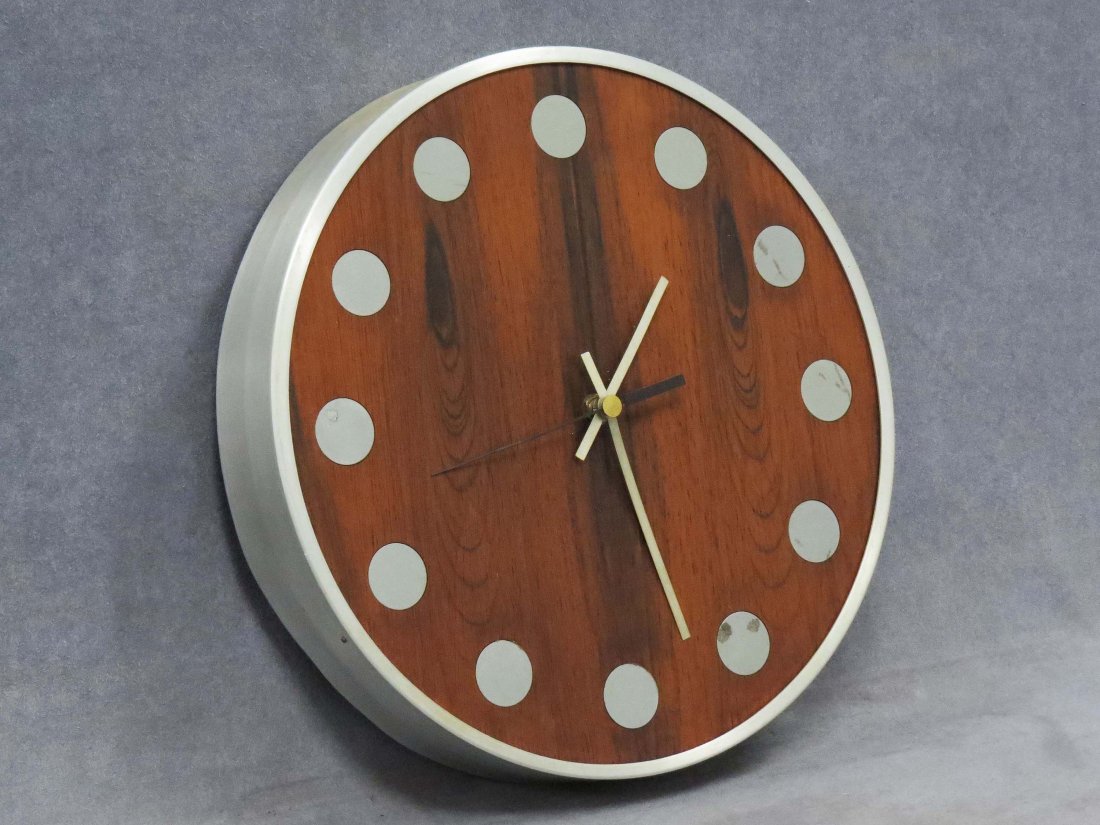MID-CENTURY GERMAN ROSEWOOD AND ALUMINUM CLOCK: MID-CENTURY GERMAN ROSEWOOD AND BRUSHED ALUMINUM CLOCK. DIAMETER 12 3/4"