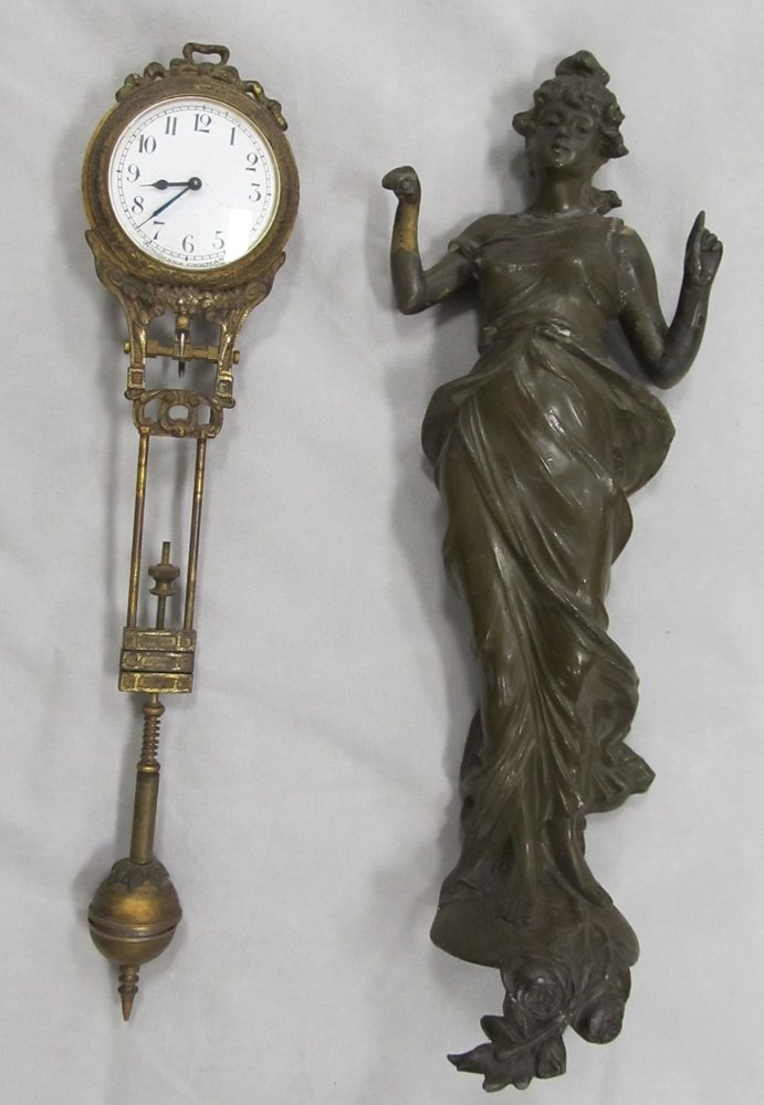 PATINATED METAL FIGURAL SWINGER CLOCK: PATINATED METAL FIGURAL SWINGER CLOCK. HEIGHT 10" (MISSING PARTS)