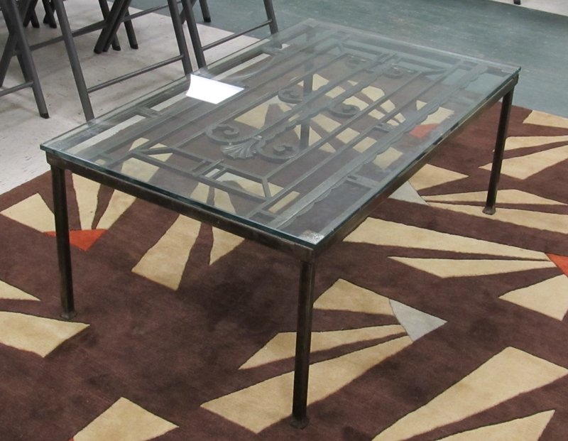 ART DECO STYLE STEEL BASE COFFEE TABLE: ART DECO STYLE STEEL BASE COFFEE TABLE WITH PLATE GLASS TOP. HEIGHT 16 1/4"; TOP 24 1/2 X 40" (EDGE CHIPS)