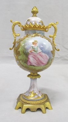 FRENCH DECORATED PORCELAIN URN WITH GILT BRONZE: FRENCH DECORATED PORCELAIN URN WITH GILT BRONZE MOUNTS, BEARS SEVRES MARK. HEIGHT 6 3/4" (TOP CRACKED)