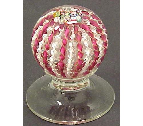 EARLY NEWEL-POST FINIAL PAPERWEIGHT: EARLY NEWEL-POST FINIAL MILLEFIORI/RIBBON TWIST PEDESTAL PAPERWEIGHT, 19TH CENTURY. HEIGHT 4 3/4"; DIAMETER BASE 4 1/4"