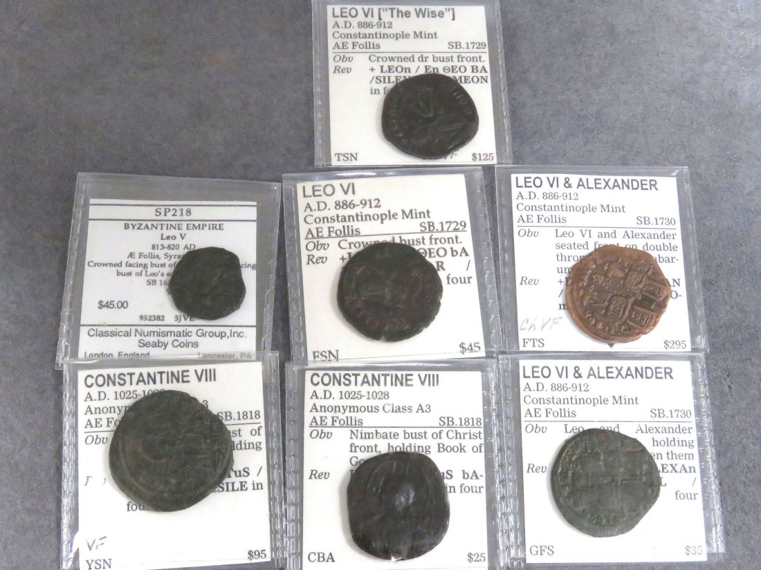 LOT (7) BYZANTINE BRONZE COINS INCLUDING LEO V: LOT (7) BYZANTINE BRONZE COINS INCLUDING LEO V, AE FOLLIS; (4) LEO VI (THE WISE), AE FOLLIS; (2) CONSTANTINE VIII, AE FOLLIS, 813-1028 AD