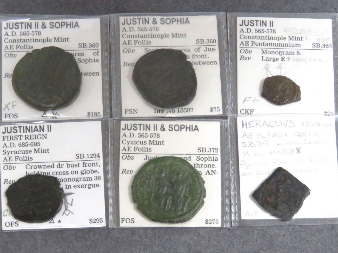 LOT (6) BYZANTINE BRONZE COINS: LOT (6) BYZANTINE BRONZE COINS INCLUDING (3) JUSTIN II AND SOPHIA, AE FOLLIS; JUSTIN II, AE PENTANUMMIUM; HERACLIUS, AE HALF FOLLIS; JUSTINIAN II, AE FOLLIS, 565-695 AD