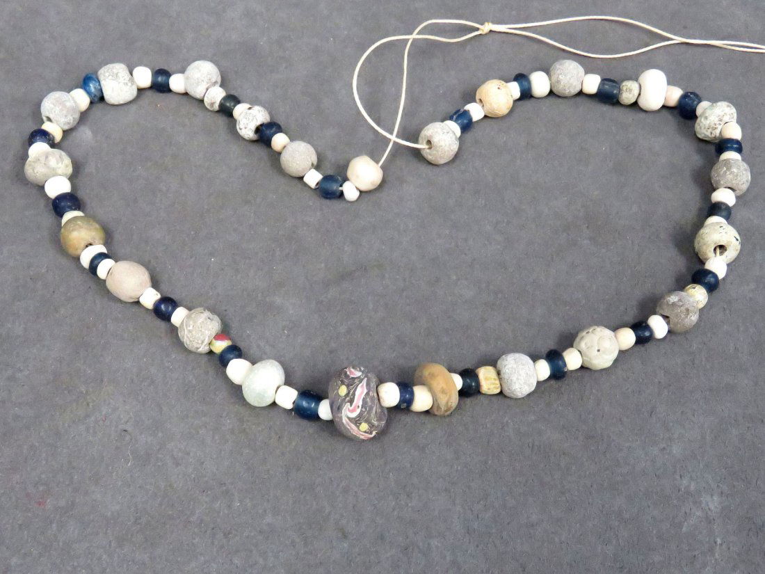 NEAR EASTERN/HOLY LAND STRAND OF BEADS: NEAR EASTERN/HOLY LAND STRAND OF BEADS INCLUDING CARVED STONE AND GLASS