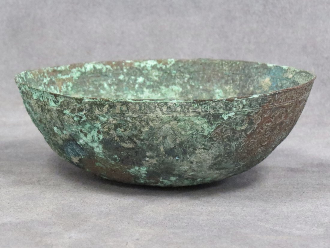 ISLAMIC BRONZE BOWL, C.500 BC: ISLAMIC BRONZE BOWL, C.500 BC. HEIGHT 2"; DIAMETER 5 1/4"