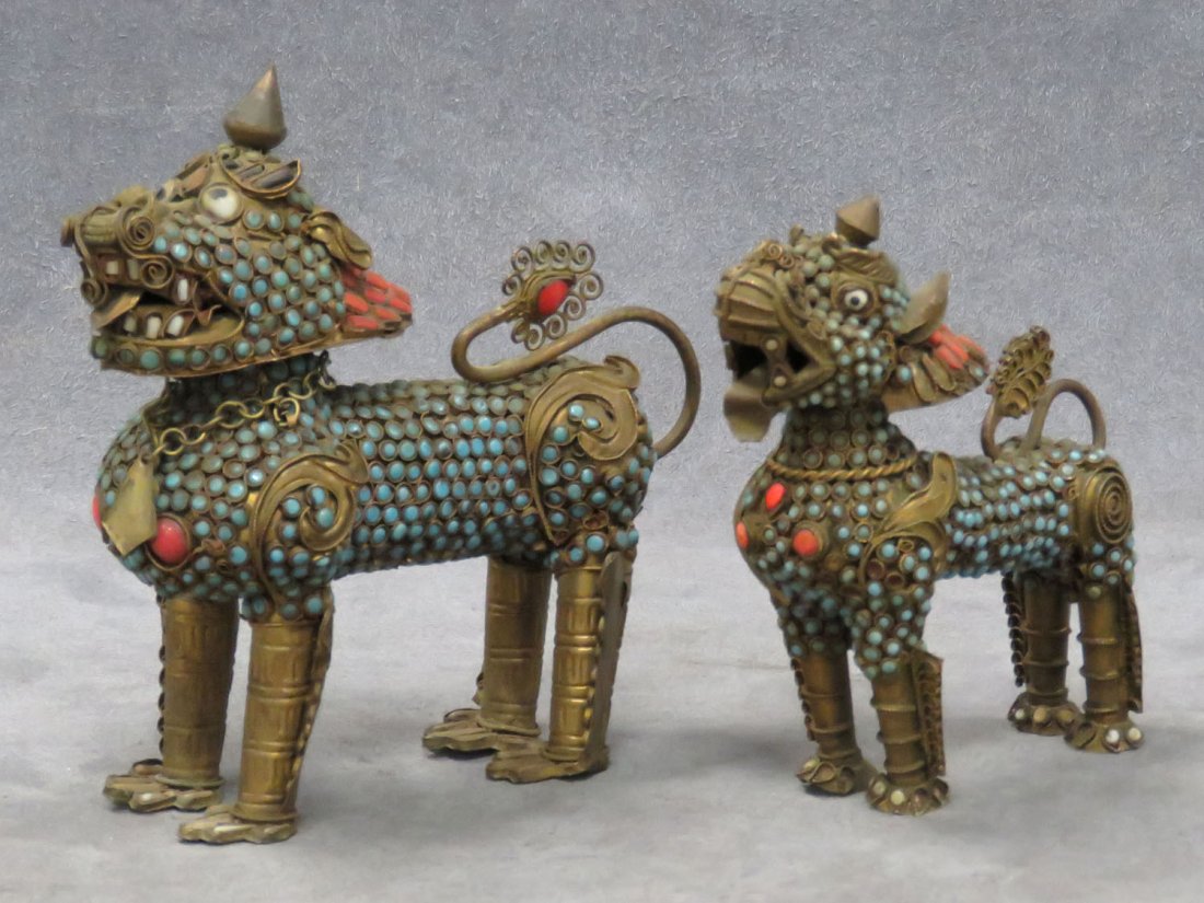 LOT (2) NEPALESE FILIGREE BRASS LION FORM CENSORS: LOT (2) NEPALESE FILIGREE BRASS LION FORM CENSORS WITH TURQUOISE AND CORAL JEWEL MOUNTS. HEIGHT 4 5/8-5" **CANNOT EXPORT**