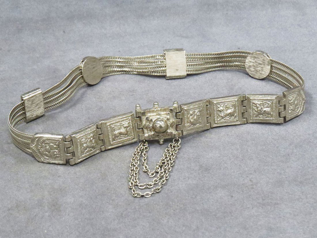 JUDITH LEIBER SILVER TONE ETRUSCAN DESIGN BELT: JUDITH LEIBER SILVER TONE ETRUSCAN DESIGN BELT. LENGTH 25"