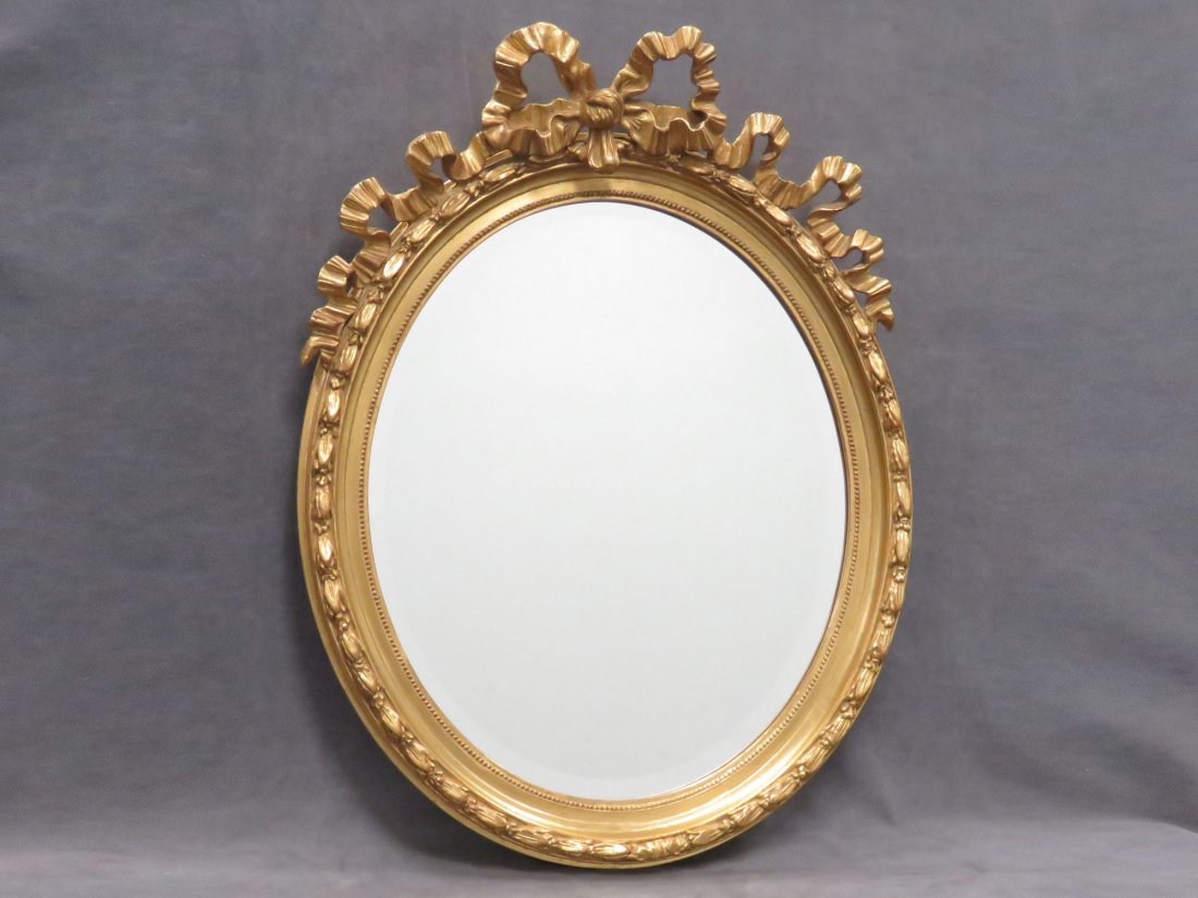 FRENCH STYLE CARVED AND GILT FRAMED OVAL MIRROR (1 of 3)