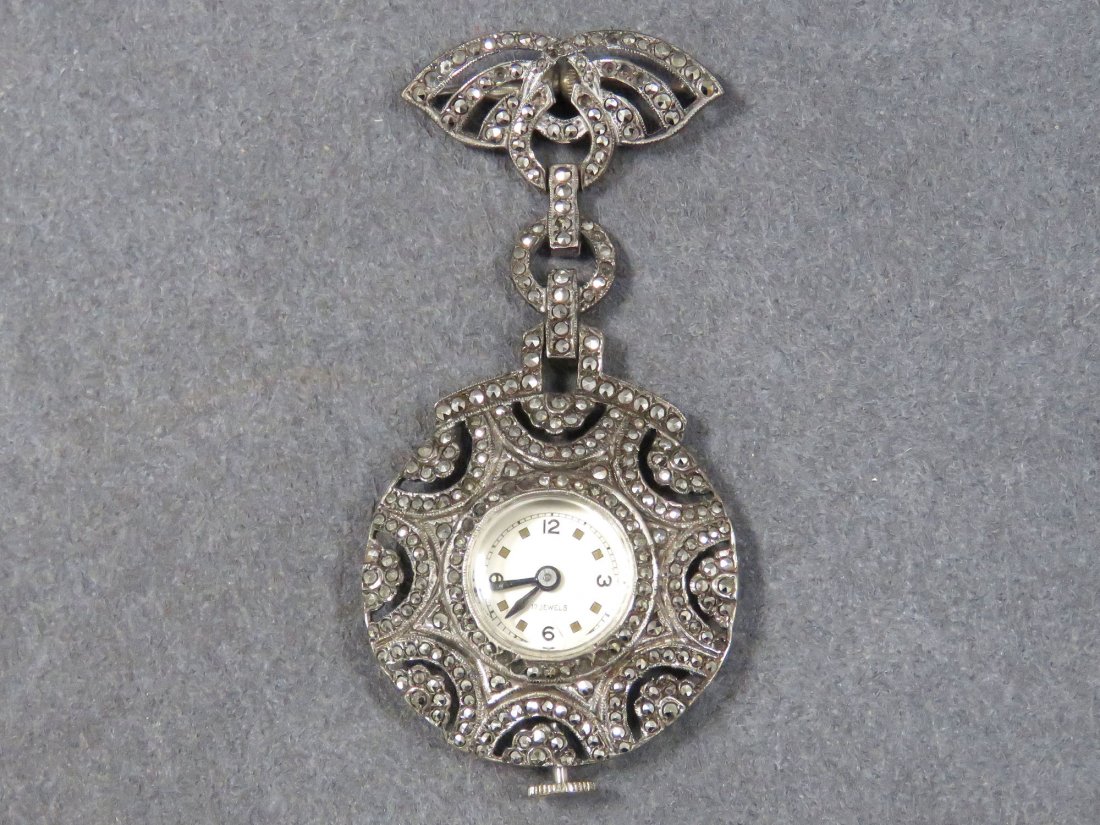 VINTAGE STERLING AND MARCASITE LAPEL PEN AND WATCH: VINTAGE STERLING AND MARCASITE LAPEL PEN AND WATCH. LENGTH 2 3/4" (NOT-WORKING)