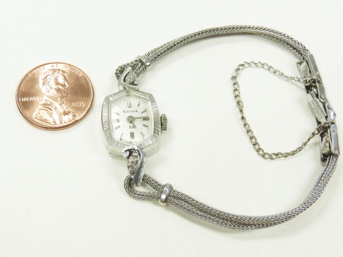 BULOVA 14K WHITE GOLD AND DIAMOND LADY'S WATCH: BULOVA 14K WHITE GOLD AND DIAMOND LADY'S WRISTWATCH WITH GOLD FILLED BRACELET BAND