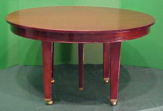 REGENCY STYLE MAHOGANY DINING TABLE: REGENCY STYLE CARVED MAHOGANY EXTENSION DINING TABLE. HEIGHT 30"; DIAMETER 54" WITH (2) LEAVES 32"/29 1/2" **DUE TO THE SIZE AND/OR FRAGILITY OF THIS LOT, STANDARD IN-HOUSE SHIPPING IS NOT AVAILABLE.
