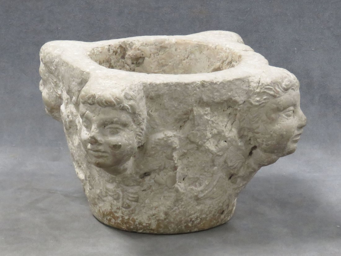 ANCIENT ROMANESQUE STONE CHERUBIC ABLUTION BOWL: ANCIENT ROMANESQUE CARVED STONE CHERUBIC ABLUTION BOWL. HEIGHT 6 1/4"; DIAMETER 11 1/2"