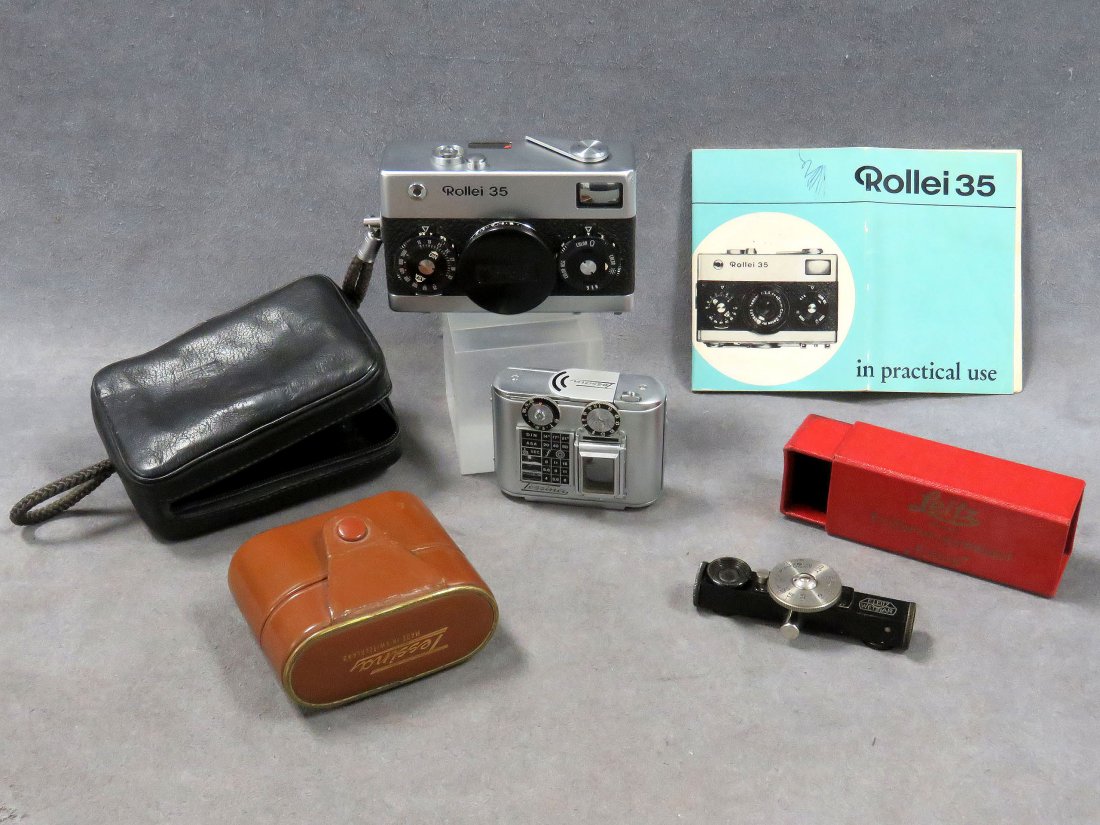 LOT INCLUDING VINTAGE ROLLEI 35 COMPACT CAMERA: LOT INCLUDING VINTAGE ROLLEI 35 COMPACT CAMERA, CASE AND INSTRUCTIONS; CONCAVA "TESSINA" SUBMINIATURE 35MM TWIN LENS REFLEX CAMERA WITH CASE; LEITZ LEICA FOKOS RANGE FINDER ACCESSORY WITH ORIGINAL BOX