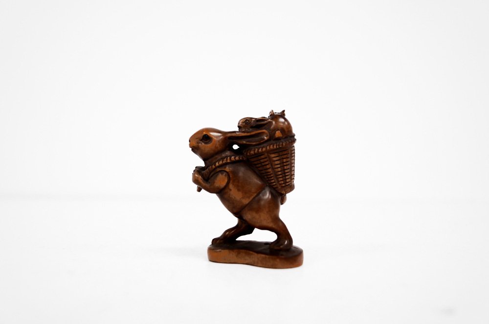 JAPANESE CARVED BOXWOOD NETSUKE, RABBIT CARRYING BASKET (1 of 3)
